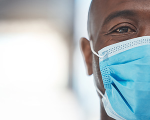 Image showing Black man doctor with covid face mask face portrait for African healthcare insurance. Sad, fear and risk in eye of a medical worker with safety gear for human surgery during corona virus pandemic