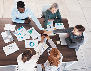 Image showing Team, hands together and meeting collaboration about analytics of sales revenue, growth and group development project. Top view, global and business people planning our vision, target and mission