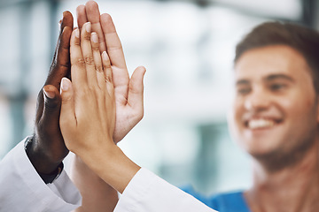 Image showing Hands, high five and collaboration with a team of a doctor, nurse and health professional working in the hospital. Teamwork, motivation and support with a medical group at work in a clinic for care