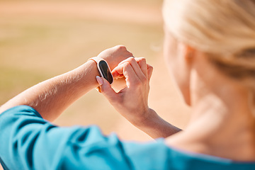 Image showing Wellness woman and smartwatch with health monitor and gps technology for outdoor fitness safety. Girl checking digital sport accessory with exercise tracker for athlete lifestyle wellbeing.