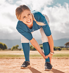 Image showing Sports, pain and woman with leg injury on baseball pitch alone. Fitness, training and a player with hurt ankle. Accident at match, injured girl in need of first aid or medical treatment at ball game.