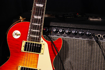 Image showing Sunburst Electric Guitar and Amp