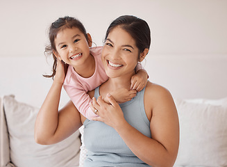 Image showing Woman with happy girl, smile in bedroom with pajamas in morning on weekend or vacation. Asian mother with child on bed, express love and happiness, in room at holiday house or their family home