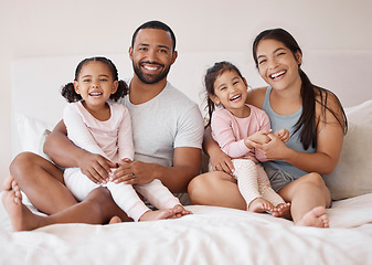 Image showing Morning, love and bedroom with portrait of a happy family for lifestyle, support and relax together. Happiness, family home and smile with parents hugging children in bed for wake up, trust and care