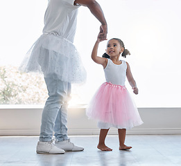 Image showing Young girl, learning ballet with dad or teacher for fitness, fun and health at house. Female child dancer in costume dress, dancing with father or dance instructor, lesson on home porch or balcony