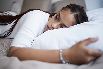 Image showing Bedroom, insomnia and depression of woman mental health problem, anxiety and stress on pillow at home. Sad, depressed and thinking young black person feeling tired, cry and lonely for breakup mistake