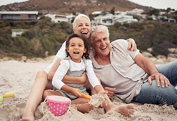 Image showing Family, time and beach with grandparents and grandchild laugh and play in sand, sitting and bonding in nature. Portrait of a happy girl enjoying seaside trip with senior man and woman, relax and fun