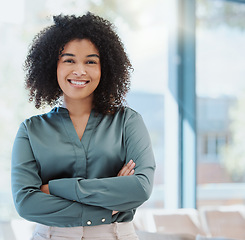Image showing Happy human resources manager smile, leadership and vision for success. Portrait of a black business woman standing arms crossed, smiling and feeling positive while working in an startup office