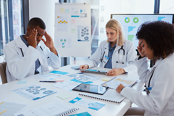 Image showing Healthcare, thinking and team of doctors in meeting with medical statistics in hospital boardroom. Data, analytics and research, overworked men and women in medicine with stress for vaccine results.