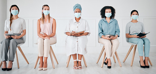 Image showing Compliance, recruitment and covid laws with business women waiting for an interview at corporate office. Hiring, corona and social distance with diverse group practice safety at company together