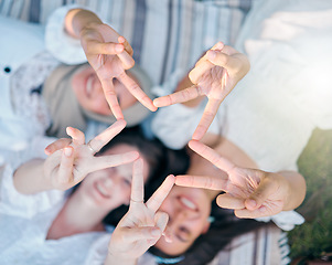 Image showing Peace, friends and hand sign while happy women bond, have fun and support each other while on a picnic at a park in nature. Above view, flare and star gesture with diversity females enjoying freedom