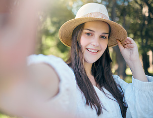 Image showing Selfie portrait of woman in nature park relax, happy and smile while in outdoor forest for peace, quiet and freedom. Happiness, trees and calm girl taking picture to post to online social media app