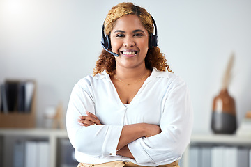 Image showing Call center, happy and smile of a woman in customer service or telemarketing consultant with crossed arms at the office. Portrait of a female professional employee in contact us, support and help