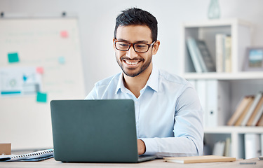 Image showing Laptop, design and marketing with a creative business man and nerd working on a computer in his office. Email, internet and creativity with a male employee at work in his modern advertising agency