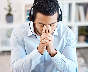 Image showing Stress, headache and anxiety with a call center consultant working in customer service, telemarketing or sales. Burnout, overworked and tired with a male at work in crm, contact us and consulting