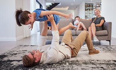 Image showing Family, play and girl in the living room with boy and mom on the sofa in the living room. Trust, love and support as happy child having fun, laugh and joy with her dad at the family home in the loung