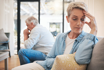 Image showing Mature couple, stress or divorce fight in house living room or home interior sofa. Angry, sad or depression woman face with anxiety in cheating affair argument with man in marriage therapy counseling