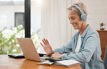 Image showing Laptop webinar, woman or video conference training and meeting on online call in home office or house room interior. Smile, happy and mature remote worker with headphones waving on tech interview