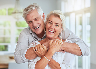 Image showing Love, couple and retirement with a senior man and woman looking happy and hugging in their home together. Smile, romance and relationship with an elderly male and female pensioner in a house