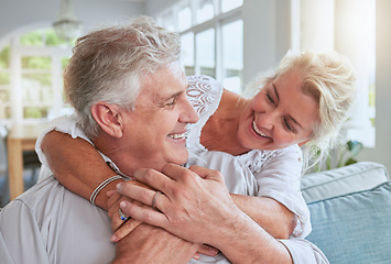 Image showing Love, happy and senior couple hug and bonding on sofa, smile and relax in home together. Retirement, freedom and happy man and woman sharing a romantic embrace, enjoying conversation and relationship