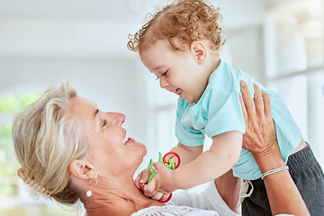 Image showing Family, love and grandma play with baby at home bonding, having fun and enjoy quality time together. Grandmother lifting up happy, smile and laughing youth kid, child or boy while playing with toys