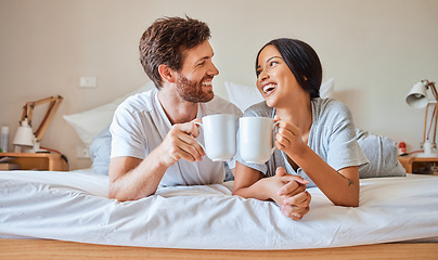 Image showing Happy morning, coffee and couple smile in bed feeling relax, love and happiness in a bedroom home. Smiling boyfriend and girlfriend together in a house laughing and spending quality time drinking tea