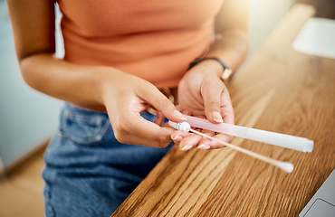 Image showing Woman with kit for covid test in hand at desk, to analyse results and get diagnosis for wellness in home. Woman with cotton swab and tube at table, do PCR test for symptoms or sign of coronavirus