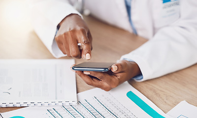 Image showing Phone, communication and doctor typing an email on a medical report while busy working with health care papers. Professional African healthcare worker texting a person the results or clinic documents