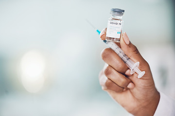 Image showing Covid, vaccine and medicine with the hand of a doctor holding medication and working in a hospital. Medical, healthcare and insurance with a cure, treatment or dose in the hands of a nurse inside