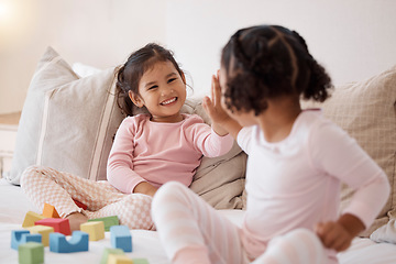 Image showing Children friends with high five for learning or celebration with building blocks together on the bed and happy smile. Baby girls or kid playing with motivation, support and fun child development game