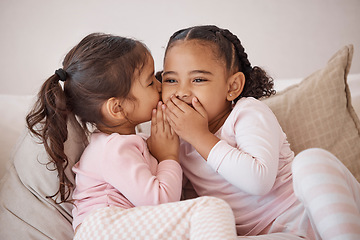 Image showing Girl, friends or children whisper secret to best friend on home sofa while relax together on play date. Communication, conversation and sisters or youth kids gossip at fun slumber party or sleepover