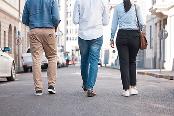 Image showing Friends, walking and city with a woman and men on a walk together outside in the city. Friendship, commute and travel with a friend group outdoor in town for exploration and sightseeing in the day