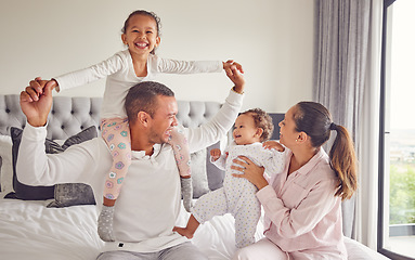 Image showing Comic family, happy and bedroom portrait while relax in home together, smile for parents love and international hotel holiday. Excited kids with mother and father on holiday and being playful in bed