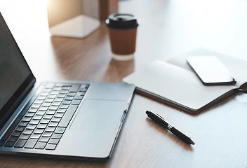 Image showing Empty desk, laptop and coffee shop with notebook, pc tech and pen for SEO, UX and UI web design at cafe store workspace. Desk or table with digital computer on internet wifi for online business email