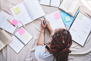 Image showing Fashion, design and education with a woman student planning a creative project on a bed at home. Idea, drawing and notebook with a female artist drawing and writing for university or college homework