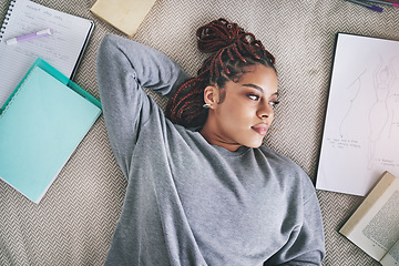 Image showing Design, fashion student and black woman on bed lost in ideas. Relax, thinking and inspiration, thoughtful young designer on break from school work. Creative student with books and drawing in bedroom.