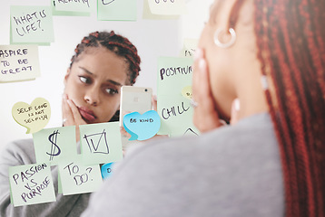 Image showing Sticky notes, mirror and woman taking a picture on a smartphone with a sad and confused face. Upset and unhappy girl reading motivational, positive affirmation and self care post it reminder.