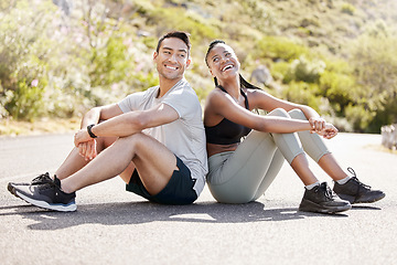 Image showing Health, fitness and friends relax after workout in nature, sitting and talking in a road outdoors. Rest, wellness and conversation with diverse man and woman taking a break together after cardio run