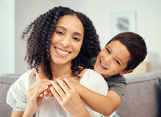 Image showing Happy kid hug mom for mothers day, love and care while relaxing together on sofa lounge at home. Portrait of smile parent, playful boy child and happiness while bonding, enjoying quality time and fun