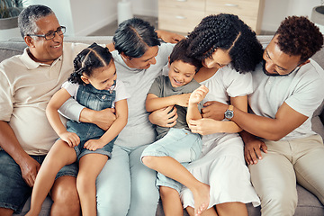 Image showing Big family, bonding fun and love of children, parents and grandparents while sitting together on the sofa at home. Happy, laughing and tickling while sharing a special moment with men, women and kids