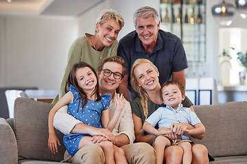 Image showing Big family, love and smile of children, parents and grandparent sharing a bond and support while sitting on sofa at home. Portrait, happiness and multi generation men and woman spending time together