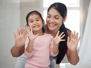 Image showing Cleaning, hand and washing with mother and daughter bonding in a bathroom at home, smiling and relaxing together. Hygiene, protection and portrait of a girl feeling happy after learning healthy habit
