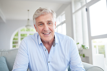 Image showing Happy senior, smile and retired man sitting alone on the sofa in the living room enjoying his retirement and free time at home. Portrait of an elderly male looking at a webcam for a video call