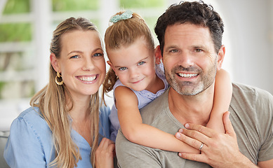 Image showing Happy family, portrait and bonding on a sofa with girl relaxing with her parents in their home. Man and woman enjoying quality time with daughter indoors, cheerful and relax in their house together