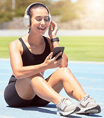 Image showing Fitness, phone and exercise with woman listening to motivation training and wellness podcast during outdoor workout. Music, radio and relax by happy, smiling girl checking message before cardio run