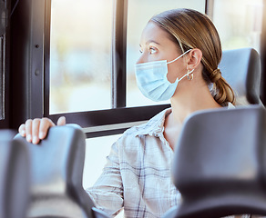 Image showing Covid, travel and compliance in bus with a woman in public transport, safety and hygiene with corona rules. Health, wellness and social distance with girl looking out window while travelling in city