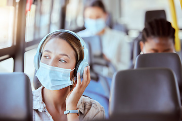 Image showing Covid, bus and woman with face mask and headphones listening to podcast on safety compliance, freedom or health risk. Girl city travel or transportation and music for corona virus radio news update