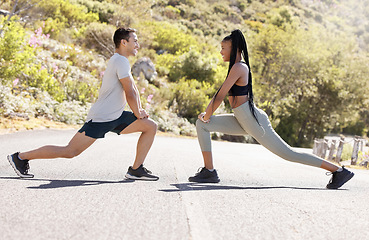 Image showing Training, fitness and interracial couple in nature on a road doing a outdoor workout stretch. Motivation, health and sport partners or friends doing a sports, athlete and cardio exercise together