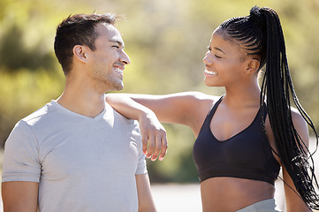 Image showing Asian man, black woman and fitness teamwork in nature park and garden environment in workout, training and exercise. Happy, smile and motivation personal trainer, friends and people with sports goals