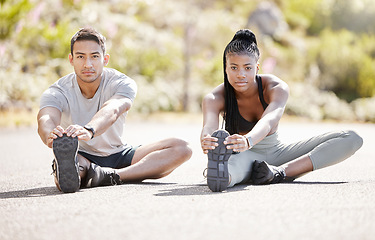 Image showing Fitness, road and couple stretching their legs to get ready for running, training and workout together in summer. Flexible, hamstring and healthy African girl with an Asian personal trainer outdoor